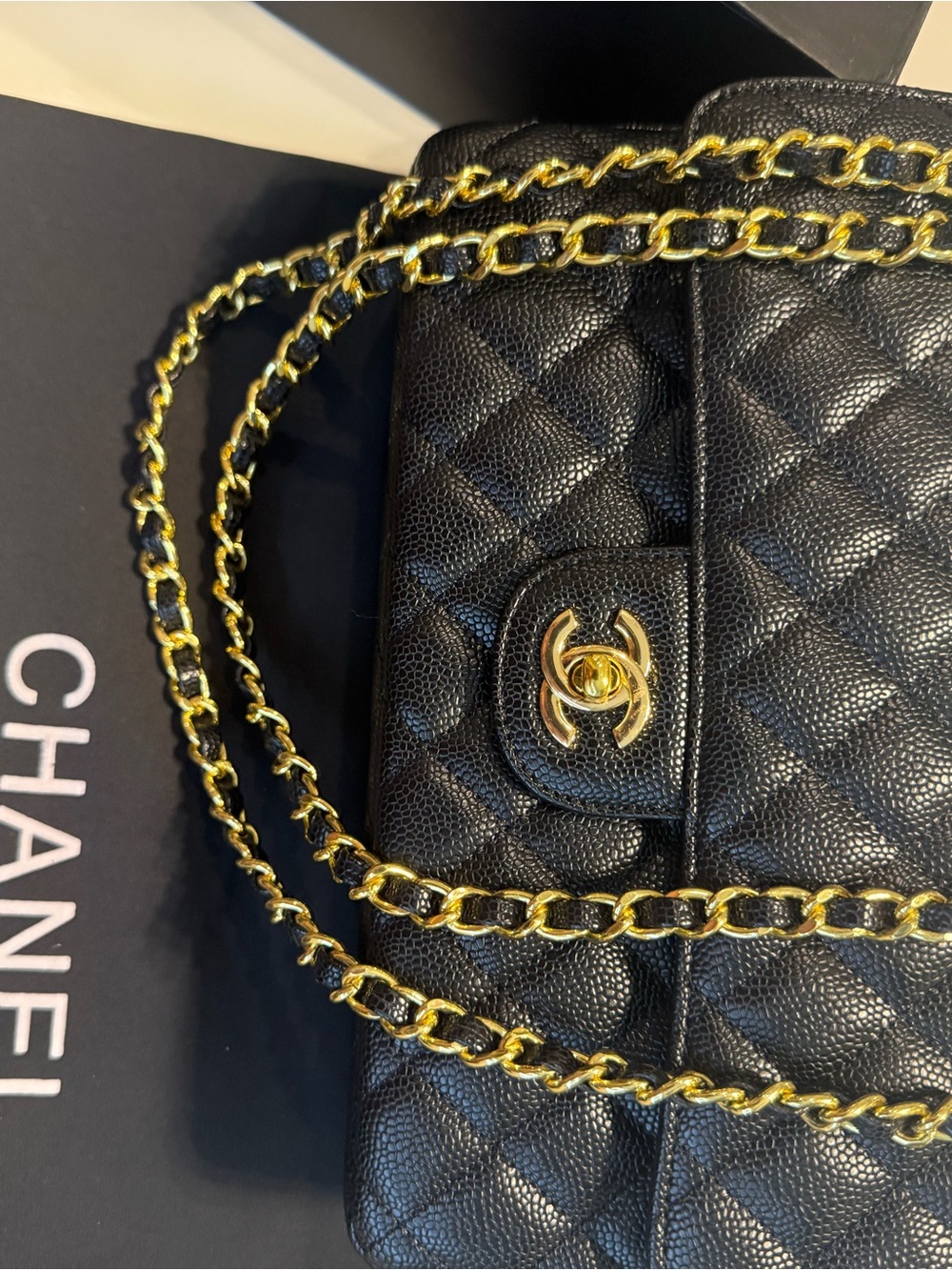 CHANEL Black Quilted Leather Shoulder Bag with Gold Chain Strap